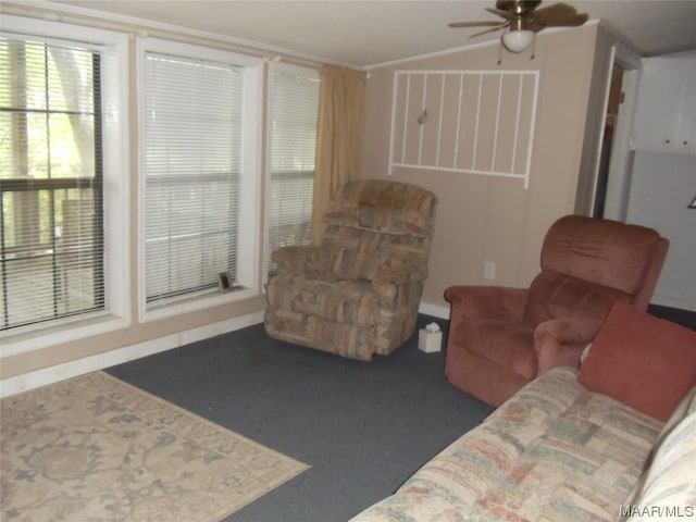 living room with plenty of natural light and ceiling fan