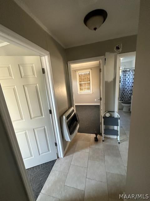 bathroom featuring tile patterned flooring and heating unit