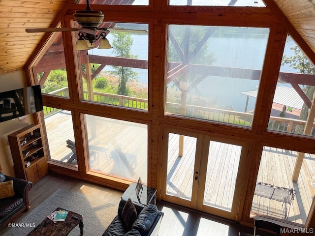 living room featuring light hardwood / wood-style floors, wood ceiling, vaulted ceiling, and a healthy amount of sunlight