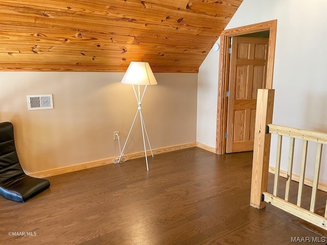 interior space with dark wood-type flooring, wood ceiling, and vaulted ceiling