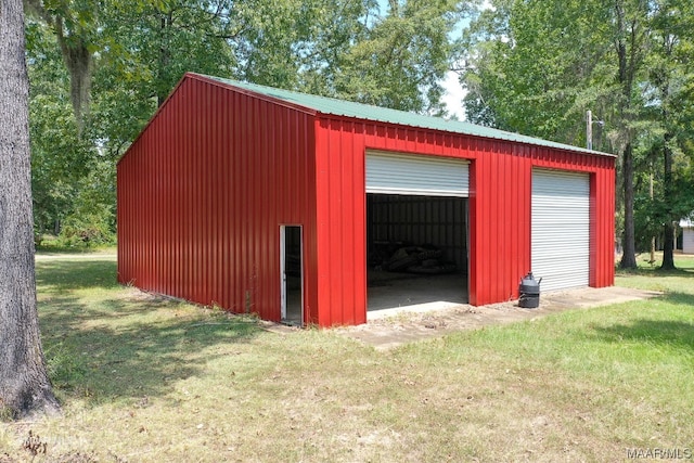 garage with a lawn