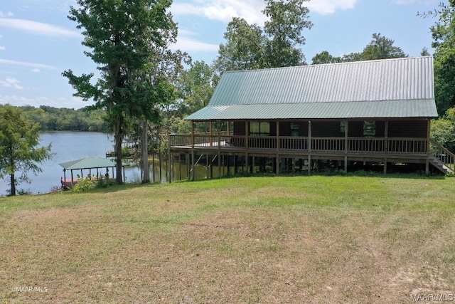 view of dock featuring a yard and a water view