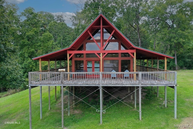 back of house with a yard and a deck