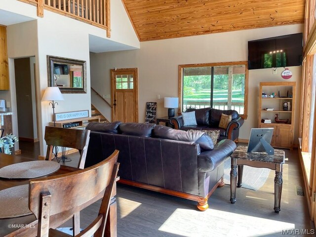 living area with stairway, wooden ceiling, and high vaulted ceiling