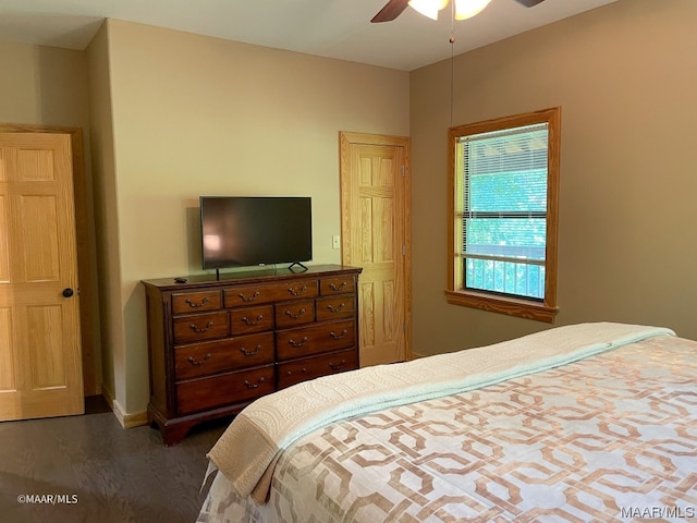 bedroom featuring dark hardwood / wood-style floors and ceiling fan