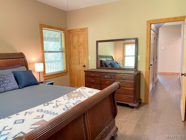 bedroom featuring light wood-style flooring