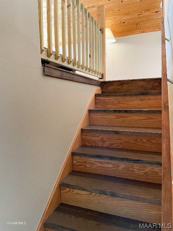 stairs featuring wood ceiling