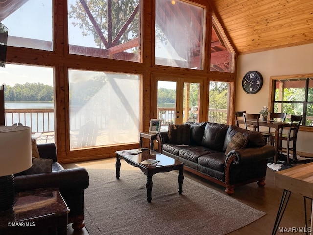 living room with a water view, wooden ceiling, high vaulted ceiling, and french doors