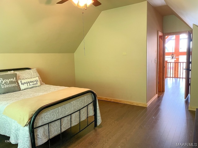 bedroom featuring lofted ceiling, ceiling fan, and dark hardwood / wood-style floors