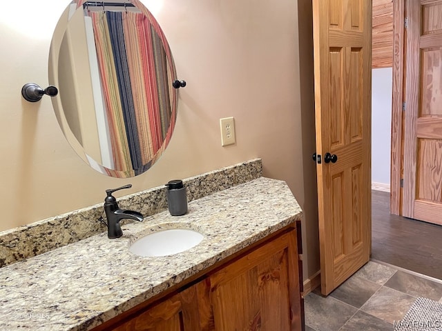 bathroom featuring tile flooring and vanity