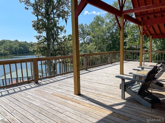 wooden deck featuring a water view