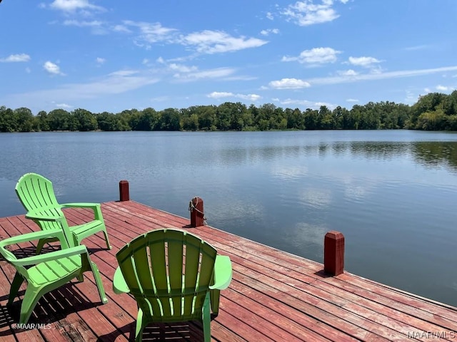 dock area featuring a water view and a wooded view