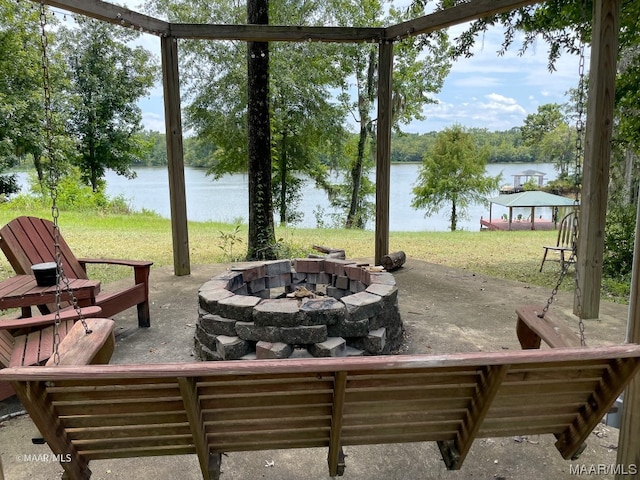 view of patio / terrace featuring a fire pit and a water view