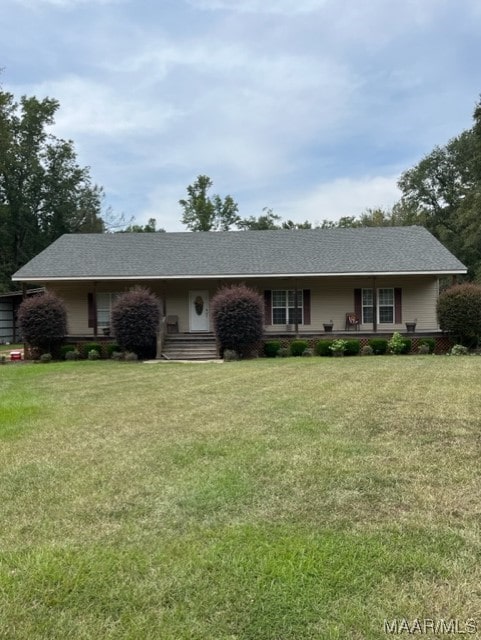 ranch-style home with a front lawn