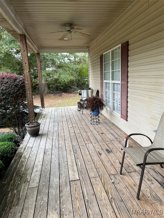 wooden terrace featuring ceiling fan and a porch