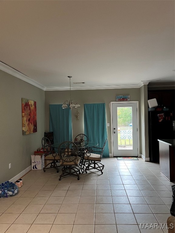 unfurnished dining area featuring light tile patterned floors, crown molding, and an inviting chandelier