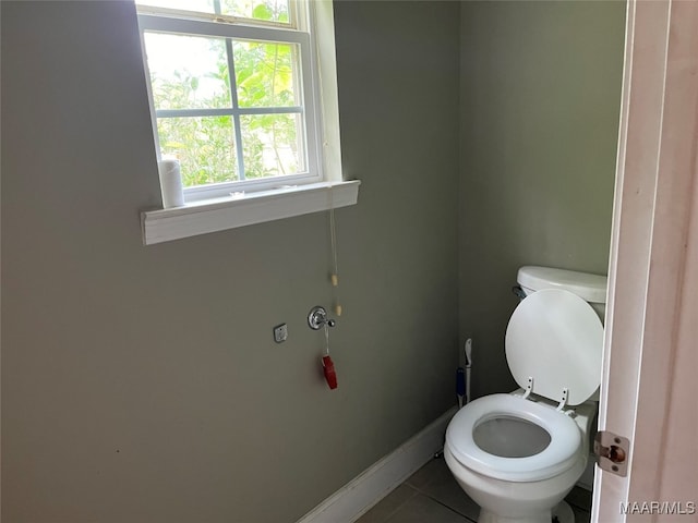 bathroom featuring tile patterned flooring and toilet