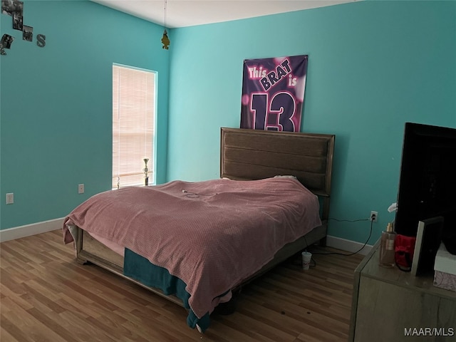 bedroom featuring hardwood / wood-style flooring