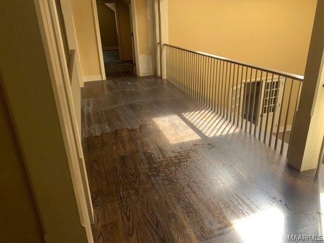 hall with dark wood-type flooring