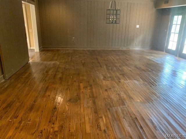 unfurnished room featuring dark hardwood / wood-style floors