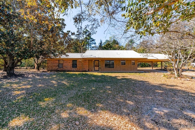 rear view of house featuring a carport