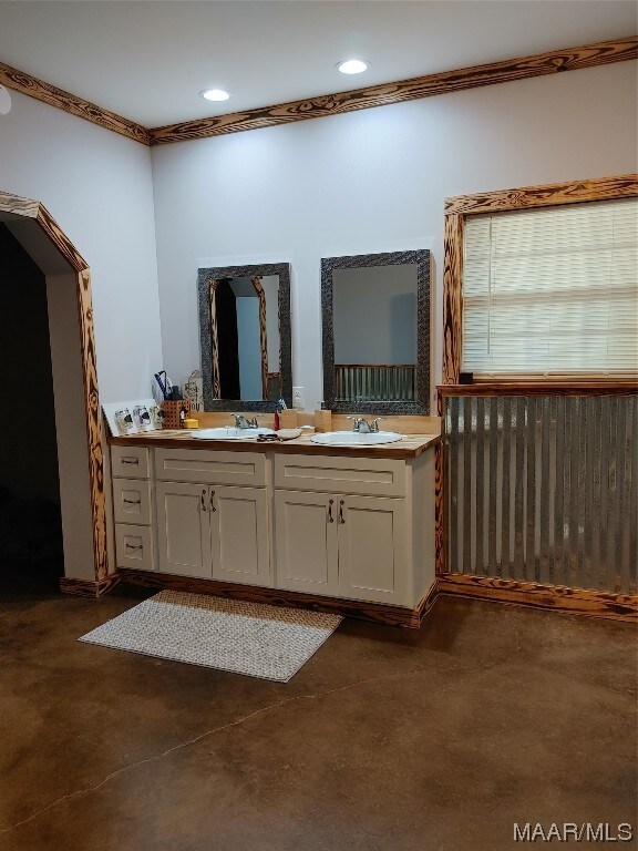 115 County Road 489th Rd, Verbena, AL 36091 - bathroom featuring concrete floors, crown molding, and dual bowl vanity