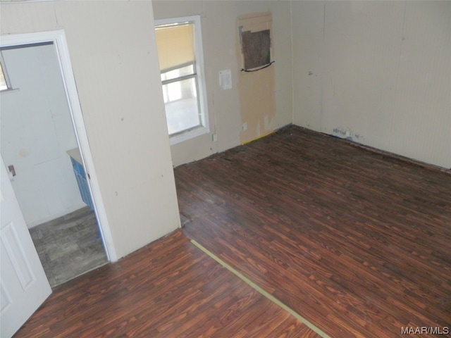 unfurnished room featuring dark hardwood / wood-style floors