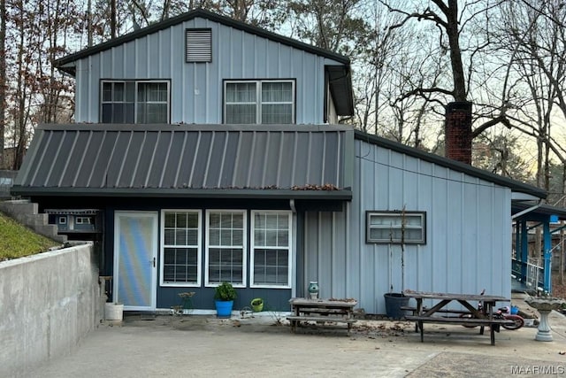 rear view of house featuring a balcony