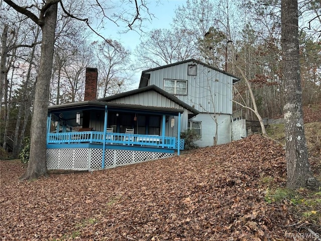 back of property featuring a porch