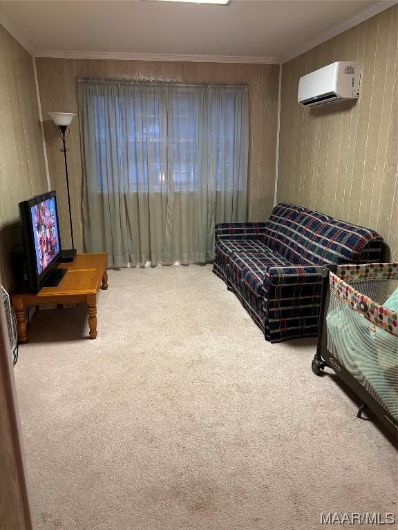 bedroom featuring carpet floors, a wall mounted air conditioner, and ornamental molding