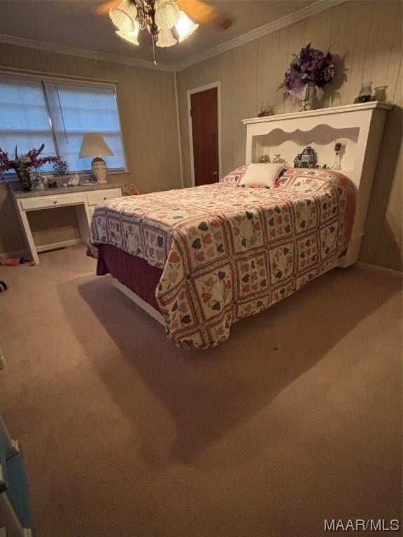 carpeted bedroom featuring ceiling fan and ornamental molding