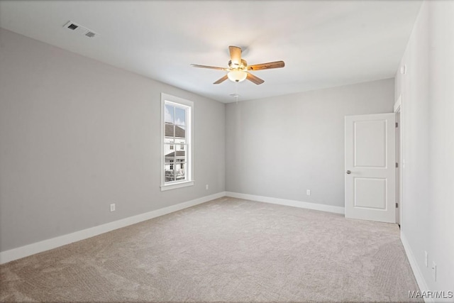 carpeted empty room with ceiling fan