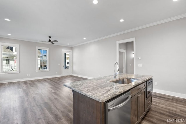 kitchen featuring dishwasher, sink, a kitchen island with sink, and ornamental molding