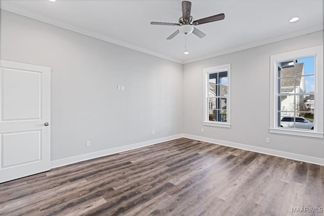 empty room with ceiling fan, ornamental molding, and dark hardwood / wood-style flooring