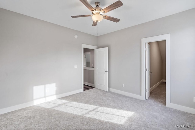 unfurnished bedroom featuring ceiling fan and carpet