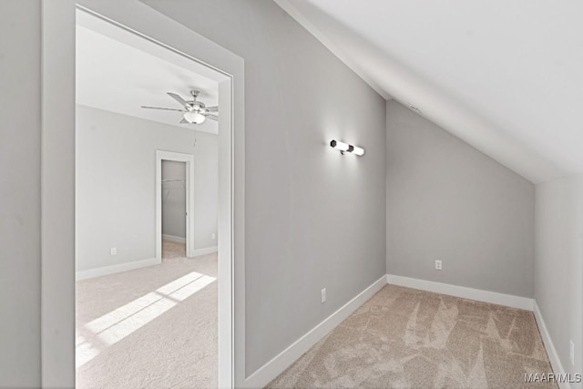 bonus room with lofted ceiling, light colored carpet, and ceiling fan