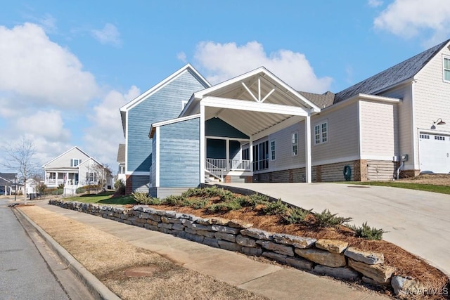 view of front facade with a garage and covered porch