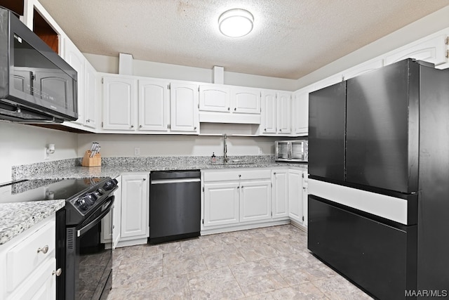 kitchen with white cabinetry, sink, and black appliances