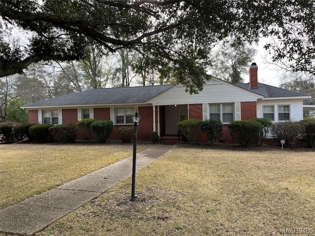 ranch-style house with a front yard