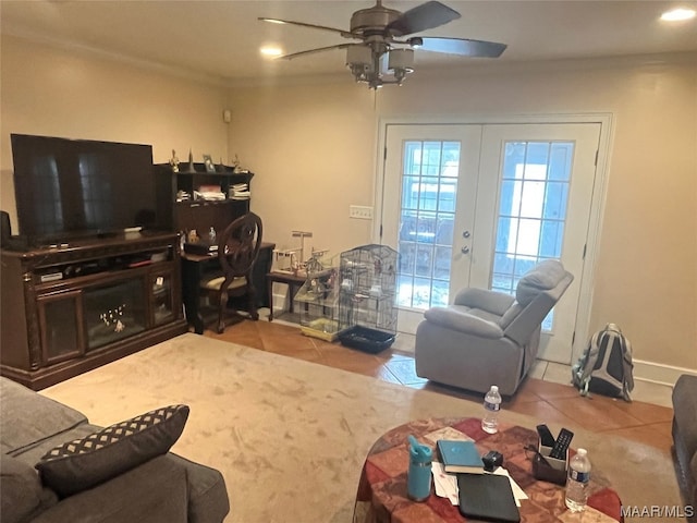 tiled living room featuring ceiling fan, french doors, and ornamental molding