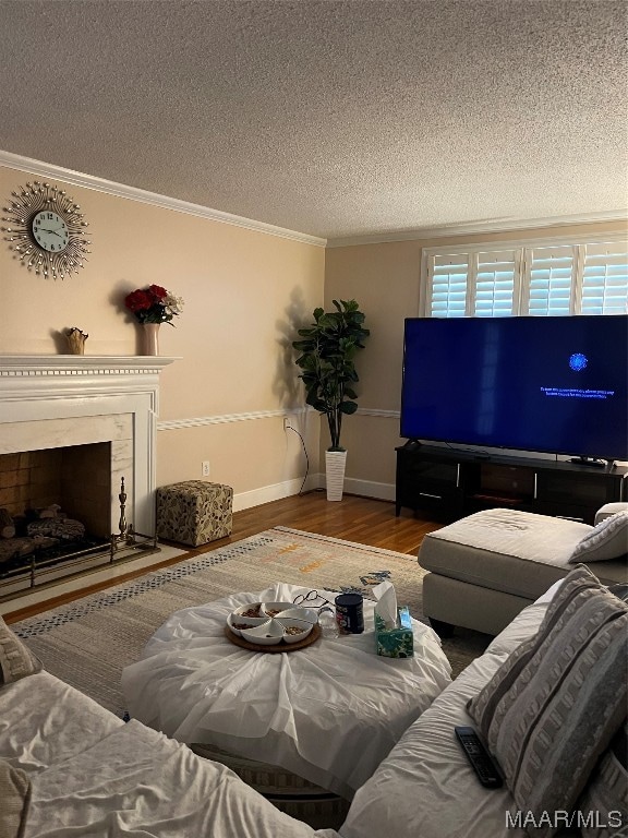 living room with a textured ceiling, dark hardwood / wood-style floors, and crown molding