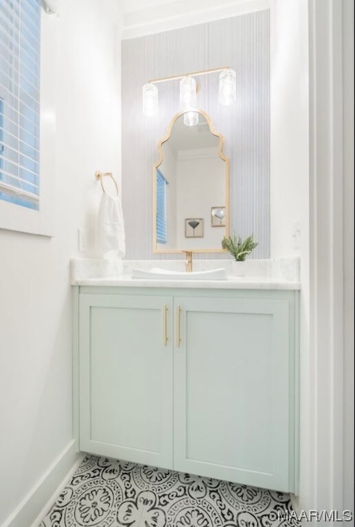 bathroom with tile flooring and large vanity