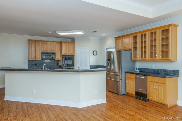 kitchen with sink, black appliances, ornamental molding, and light hardwood / wood-style flooring