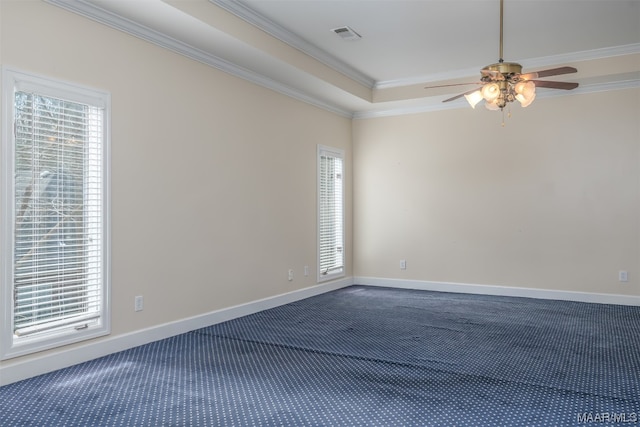 spare room with carpet flooring, ornamental molding, and ceiling fan