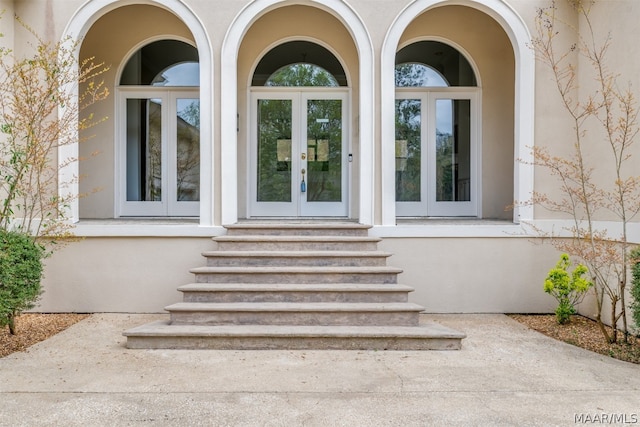 entrance to property featuring french doors