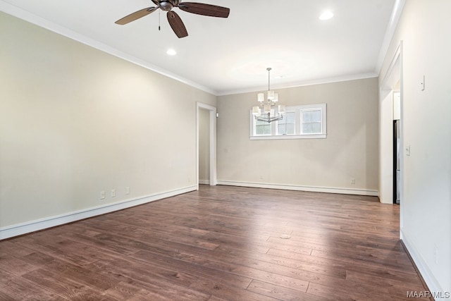 empty room featuring ornamental molding, dark wood-type flooring, and ceiling fan with notable chandelier