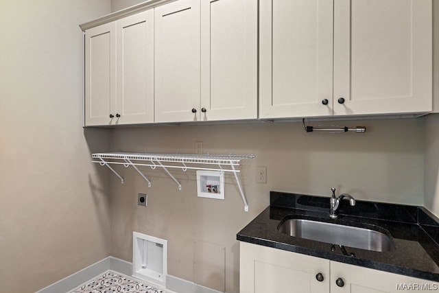 clothes washing area featuring tile flooring, sink, electric dryer hookup, washer hookup, and cabinets