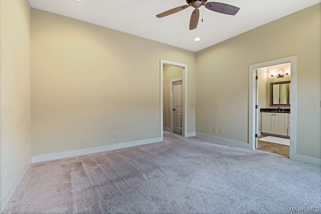 unfurnished room featuring ceiling fan and light colored carpet