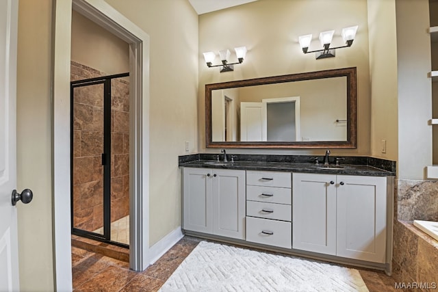 bathroom with double sink vanity, shower with separate bathtub, and tile floors