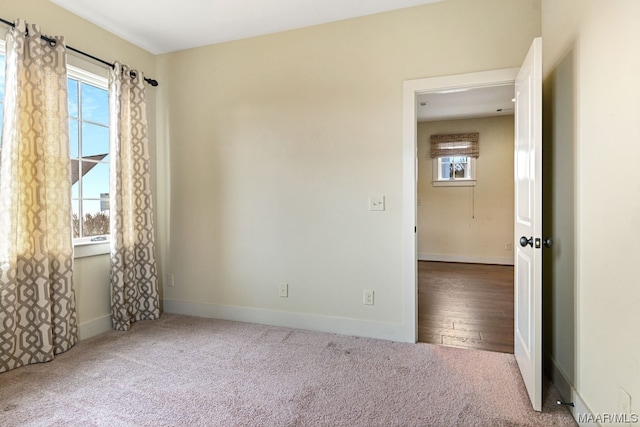 unfurnished room featuring a wealth of natural light and light hardwood / wood-style flooring